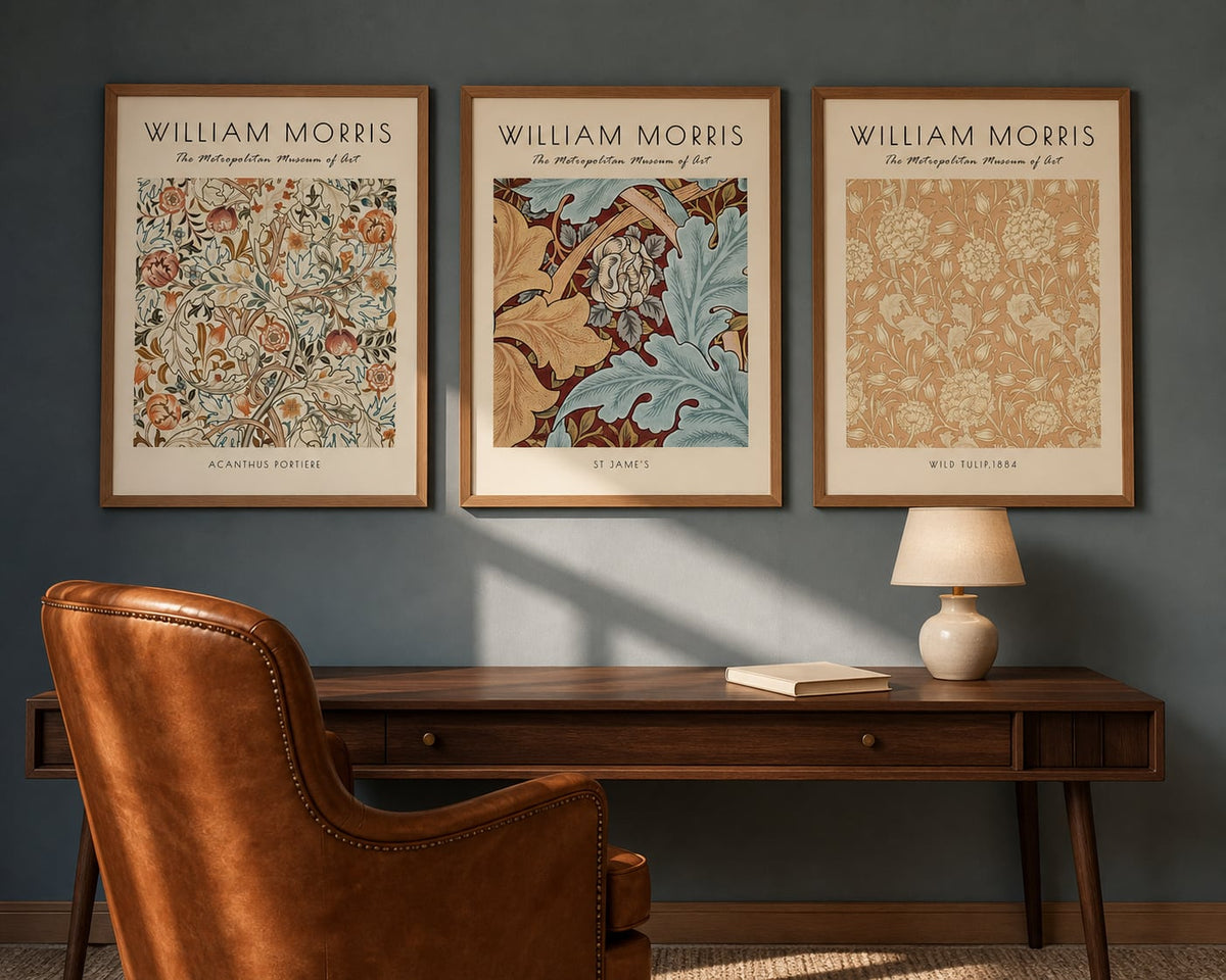 Morris Botanical Gallery Trio above a walnut desk in a dusty blue reading room