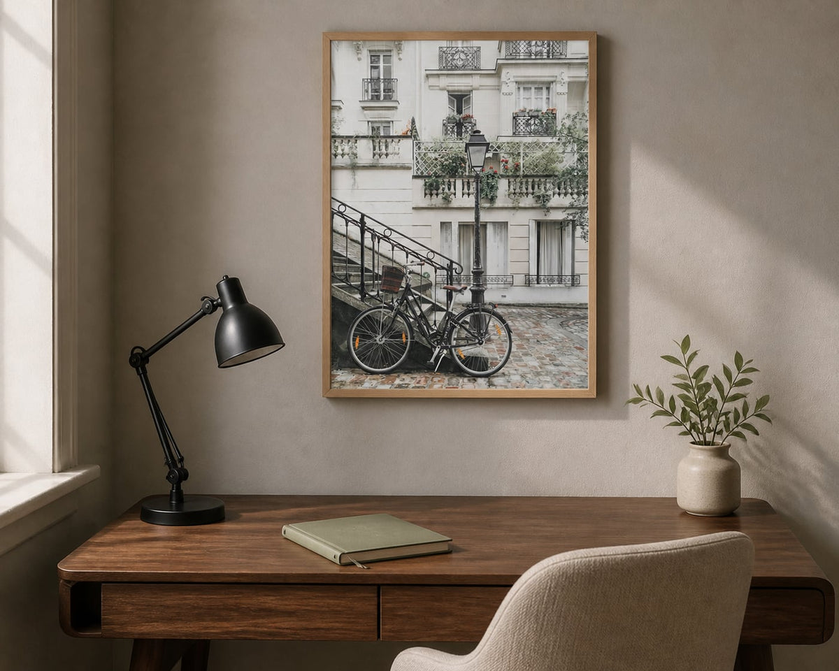 Paris Bicycle Print above a walnut desk in a warm gray home office
