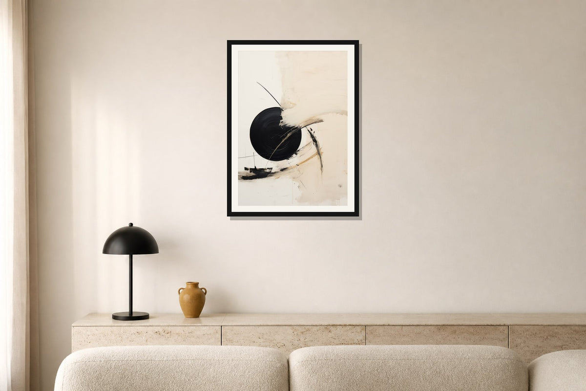 Black Orbit Abstract Print print displayed in a living room matched to its warm ivory, black, ochre palette