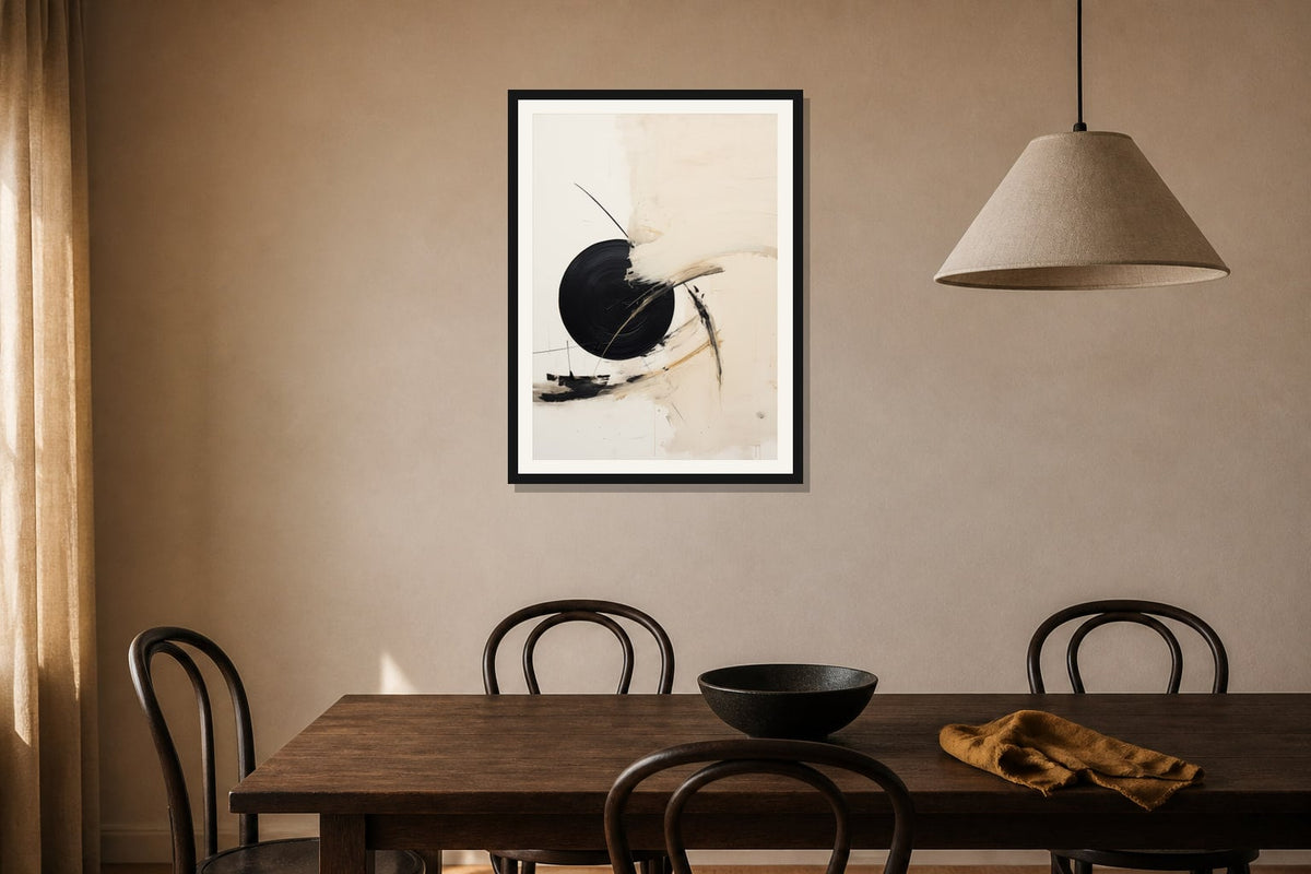 Black Orbit Abstract Print print displayed in a dining room matched to its warm ivory, black, ochre palette