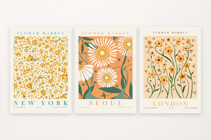 Three yellow-orange flower prints labeled New York, Seoul, and London.
