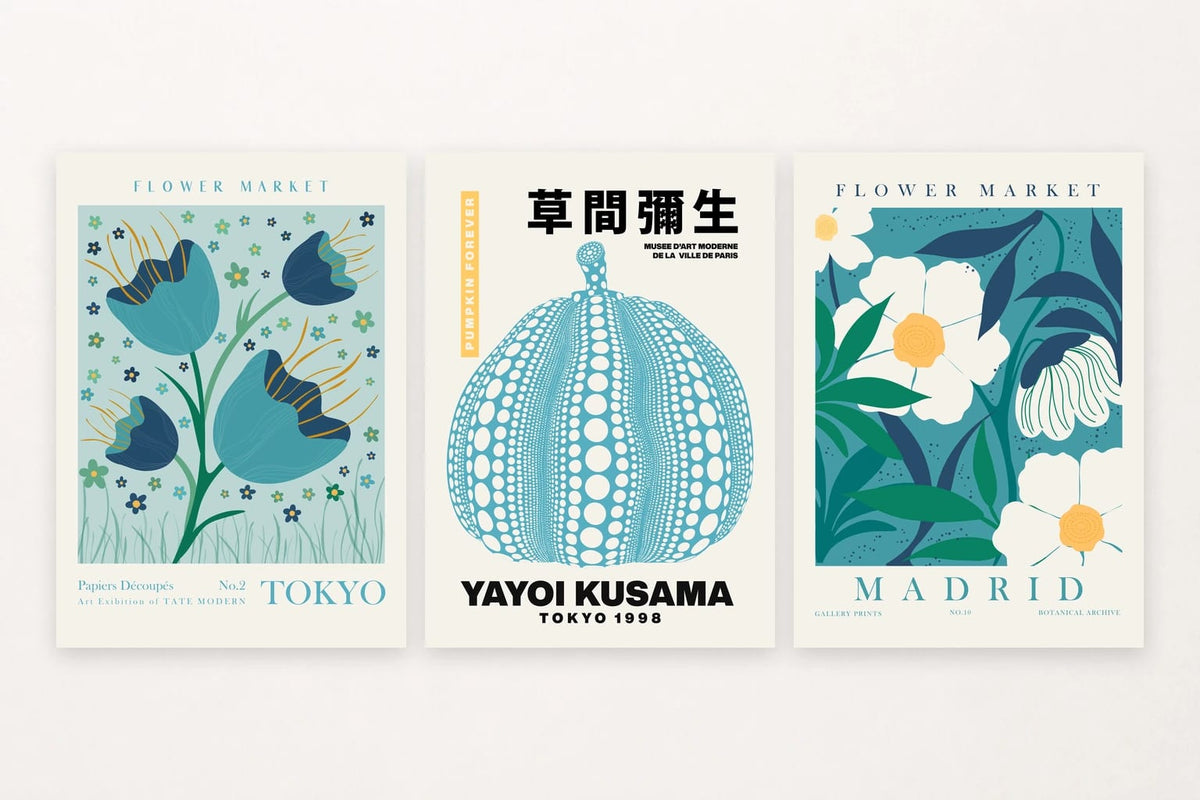 Three blue-green botanical prints with a flower, dotted pumpkin, and white blooms.