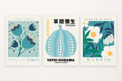 Three blue-green botanical prints with a flower, dotted pumpkin, and white blooms.