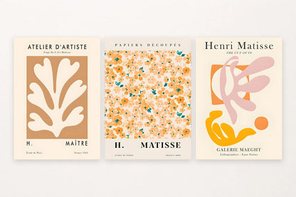 Three botanical prints with leaf and flower forms and visible French lettering.