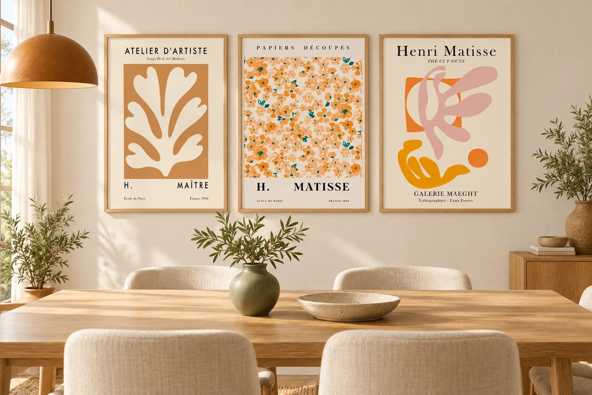 Botanical triptych displayed in a light dining room.