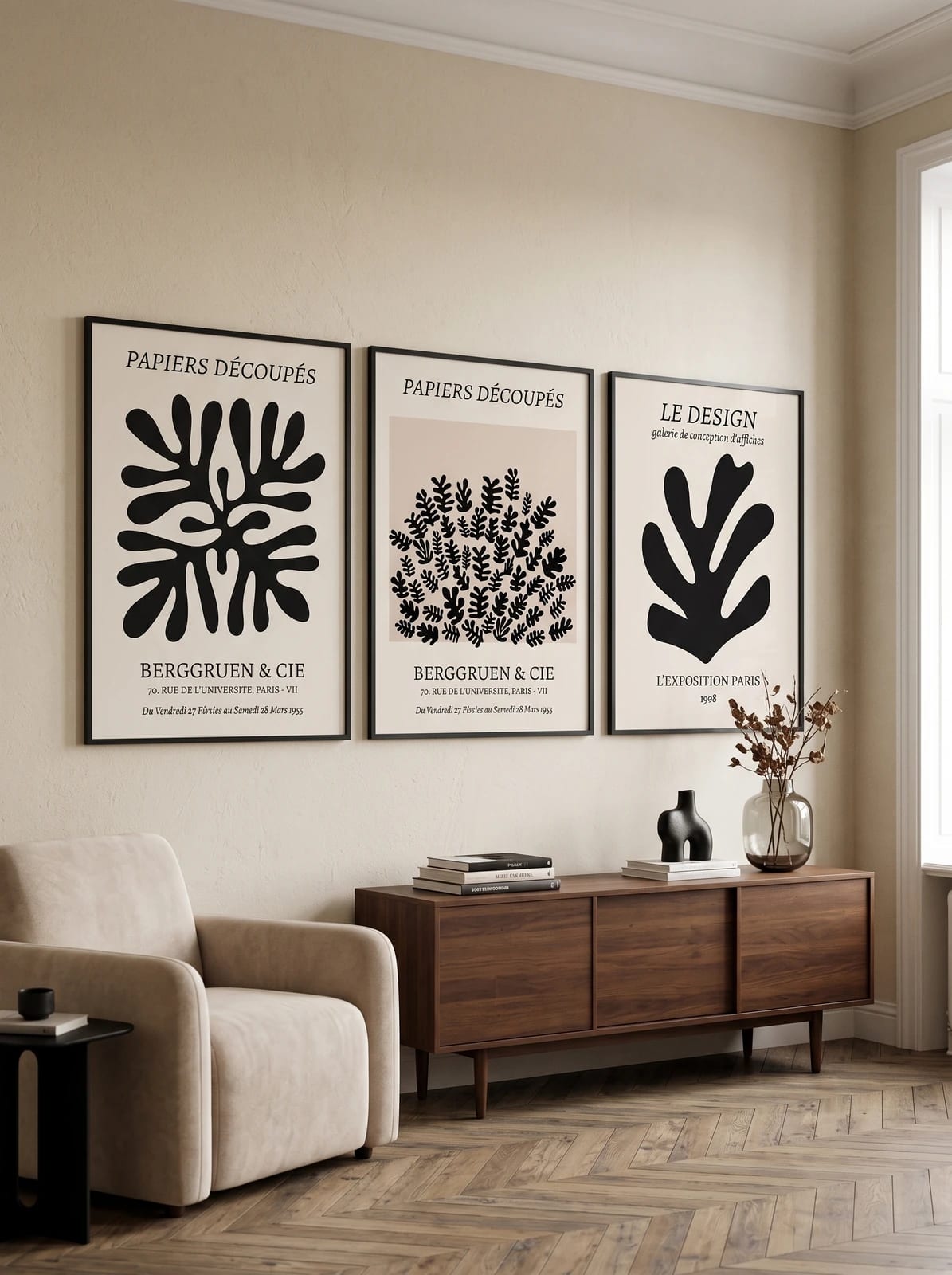 Three graphic botanical prints arranged together on a light wall.