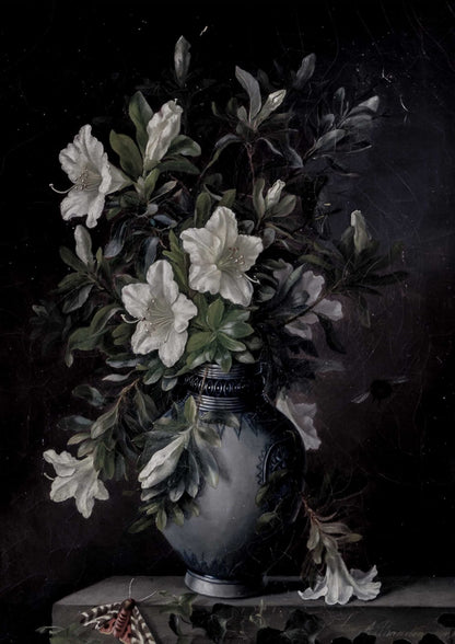 White flowers sit in a gray-blue vase.