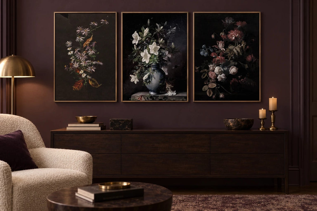 Three botanical prints hang on a dark plum living-room wall.