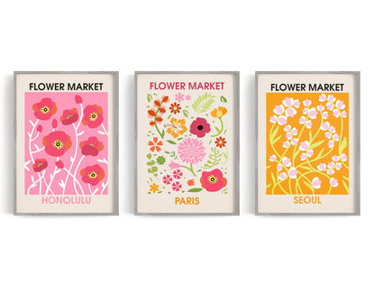Bright Flower Market Trio showing three illustrated flower-market posters celebrate Honolulu, Paris, and Seoul with bold.