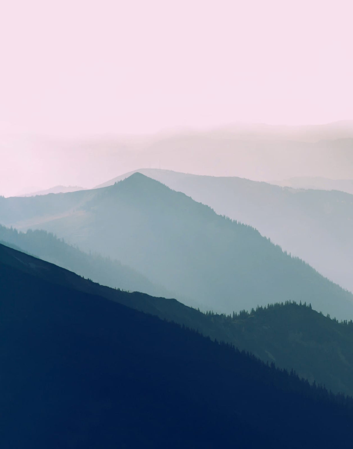 Two layered blue-green mountain panels beneath a muted rose and cream sky, panel 1 of 2