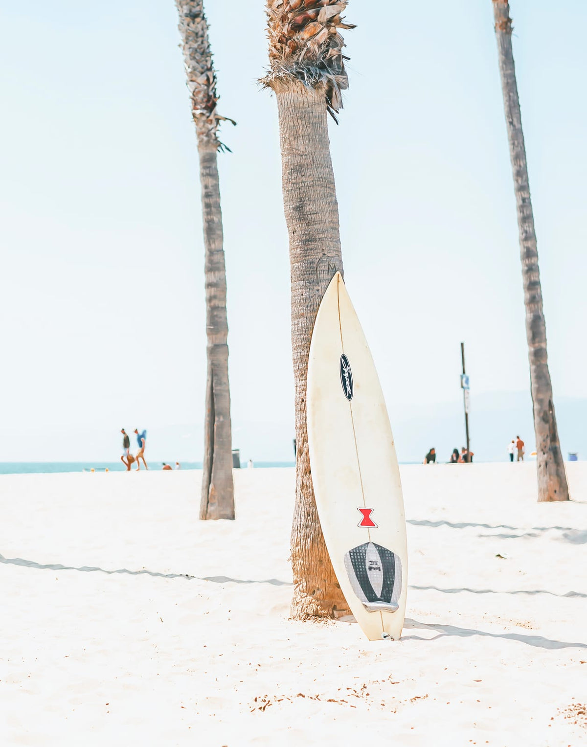 Three beach lifestyle panels with palms, surf, and an orange van by the shore, panel 1 of 3
