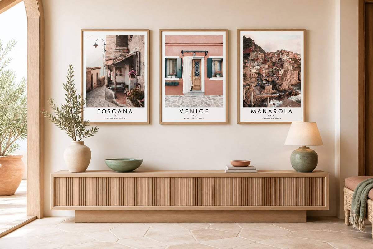 Travel triptych above a pale-walnut console with terracotta and sage accents