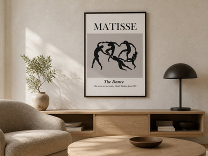 Black-and-cream linked-figure poster in a cream living room with mushroom upholstery