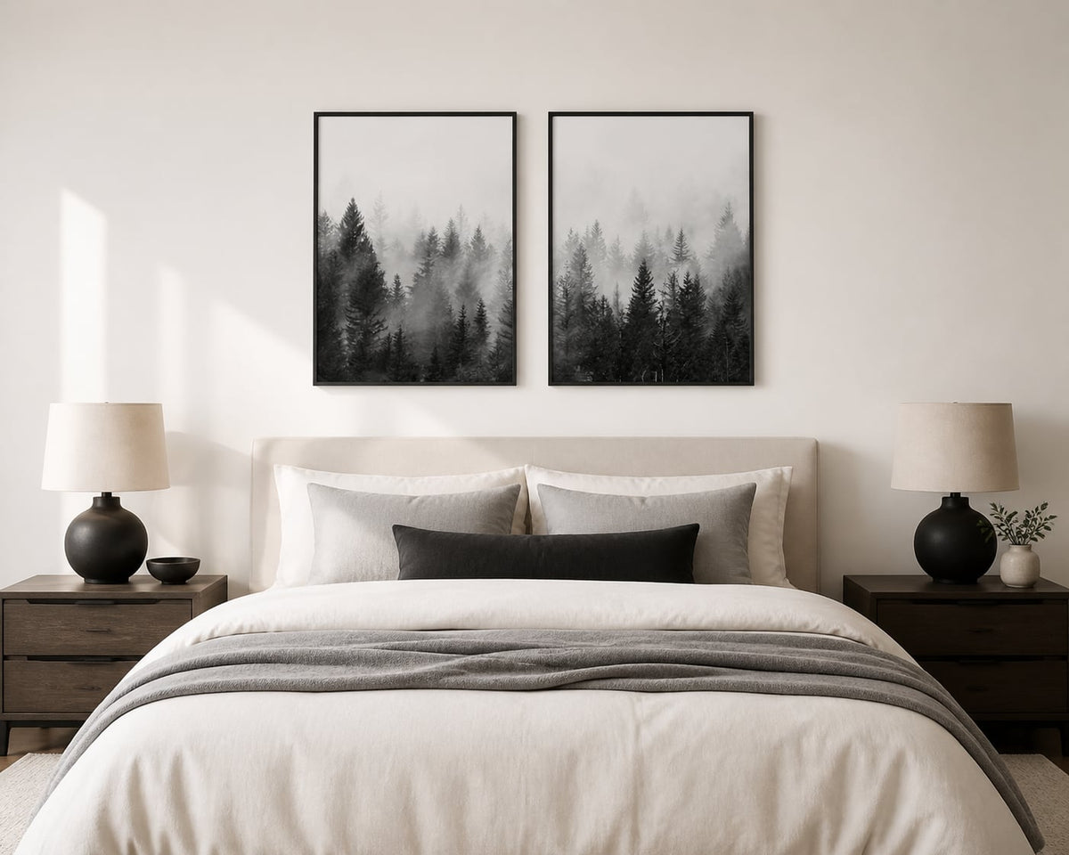 Monochrome misty-forest pair above an ivory and soft-gray bed