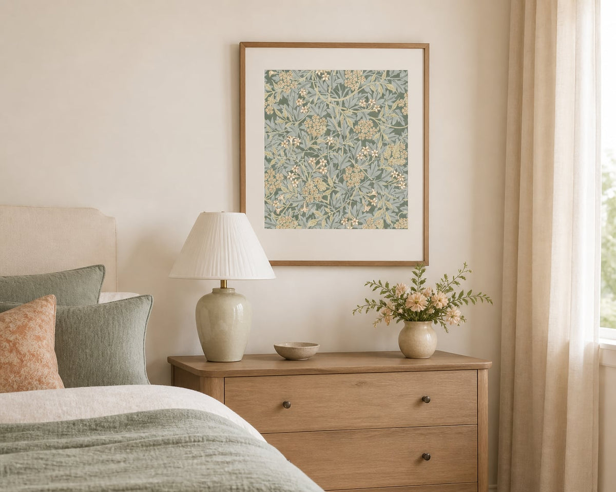 Sage botanical pattern print in a cream bedroom with muted peach accents