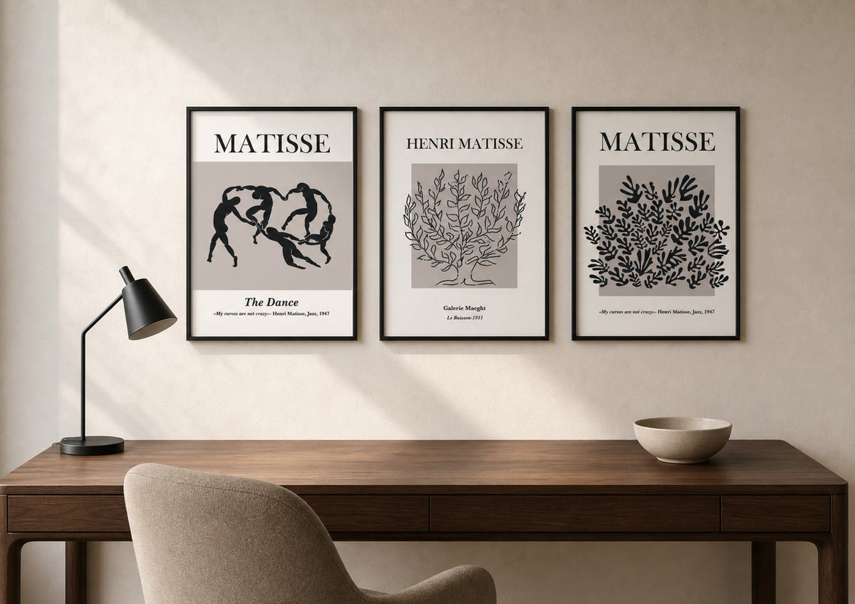 Neutral modernist triptych above a walnut desk in a warm ivory office
