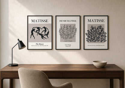 Neutral modernist triptych above a walnut desk in a warm ivory office