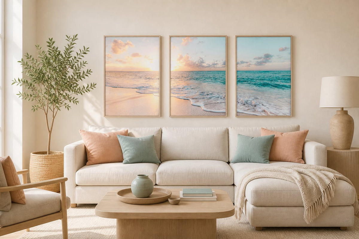 Pastel coastal triptych in an ivory living room with peach and turquoise accents