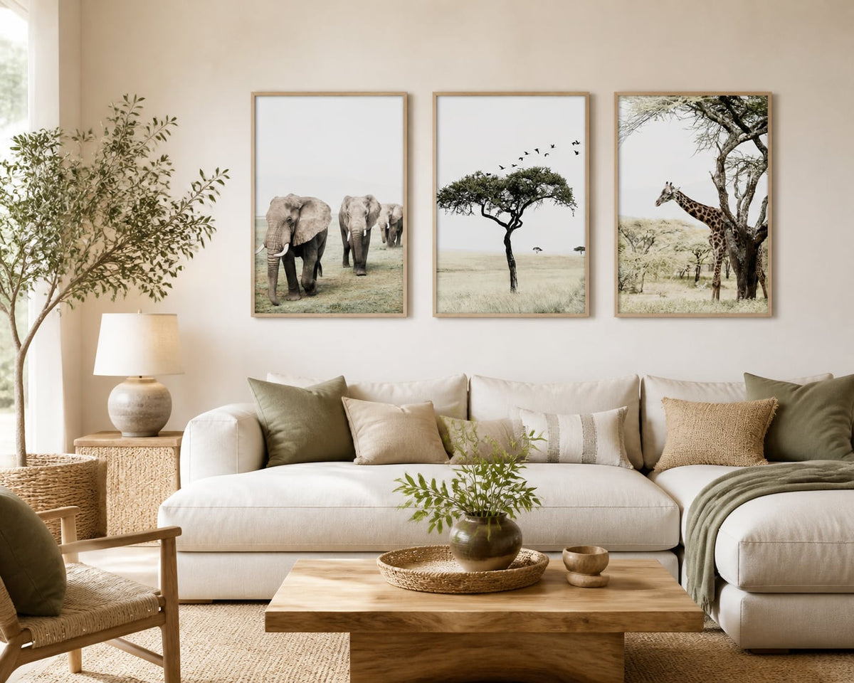 Neutral wildlife triptych in a warm ivory living room with olive and pale oak