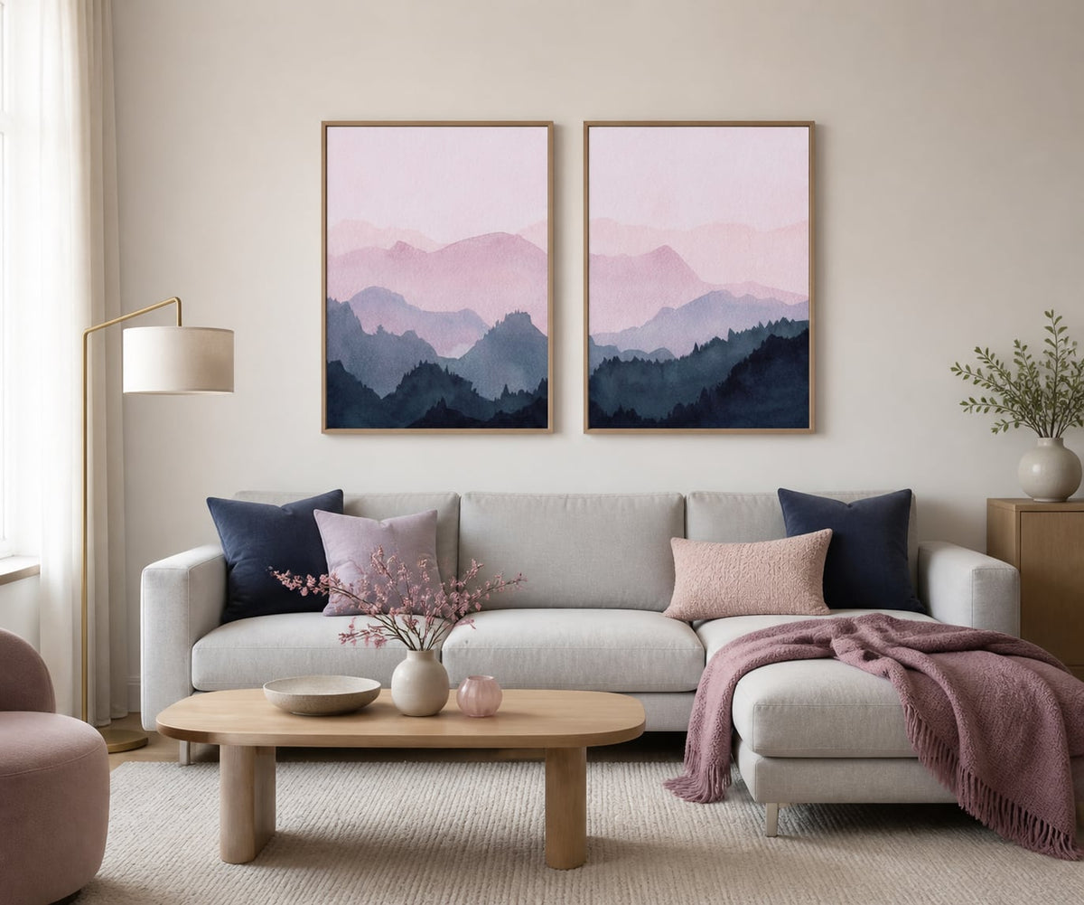 Blush and navy mountain-ridges pair in a soft gray living room