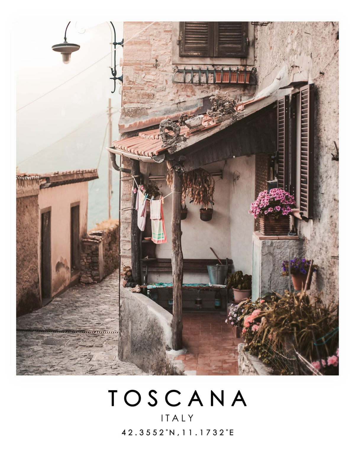 Narrow old-town street with warm stone walls and printed travel text