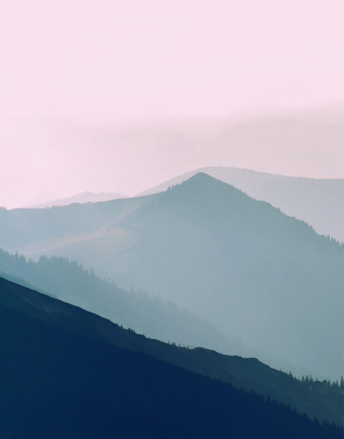 Three layered blue-green mountain panels beneath a pale pink horizon, panel 1 of 3