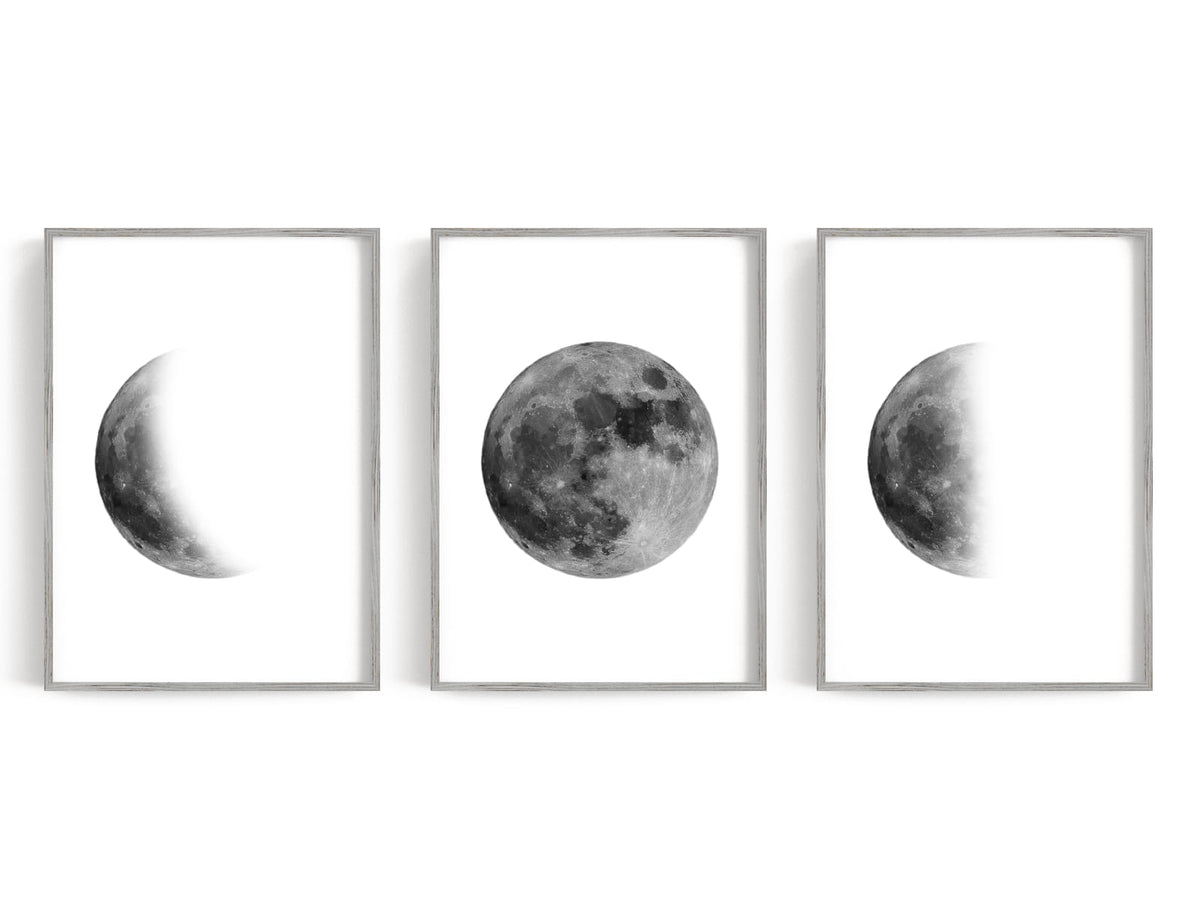 Monochrome moon phases with a full moon centered between two partial phases