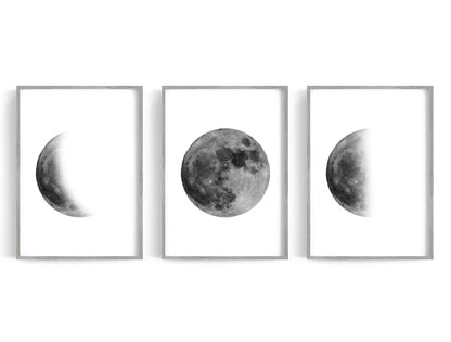 Monochrome moon phases with a full moon centered between two partial phases