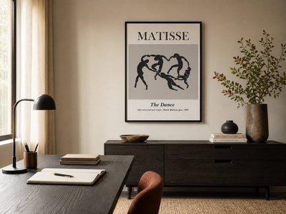 Black-and-cream linked-figure poster in a warm neutral home office
