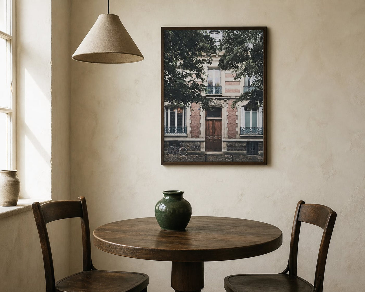Montmartre Doorway Print above a walnut dining table in a warm cream room
