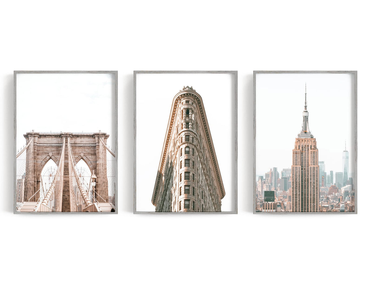 Three black-and-white city architecture prints displayed together
