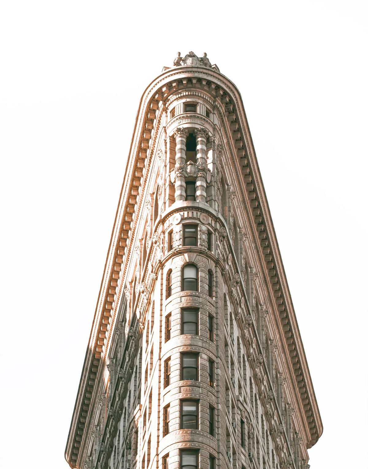 Wedge-shaped building facade in a monochrome city scene