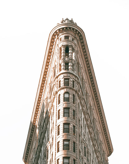 Wedge-shaped building facade in a monochrome city scene