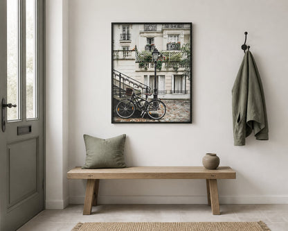 Paris Bicycle Print above a pale oak bench in a chalk white entryway