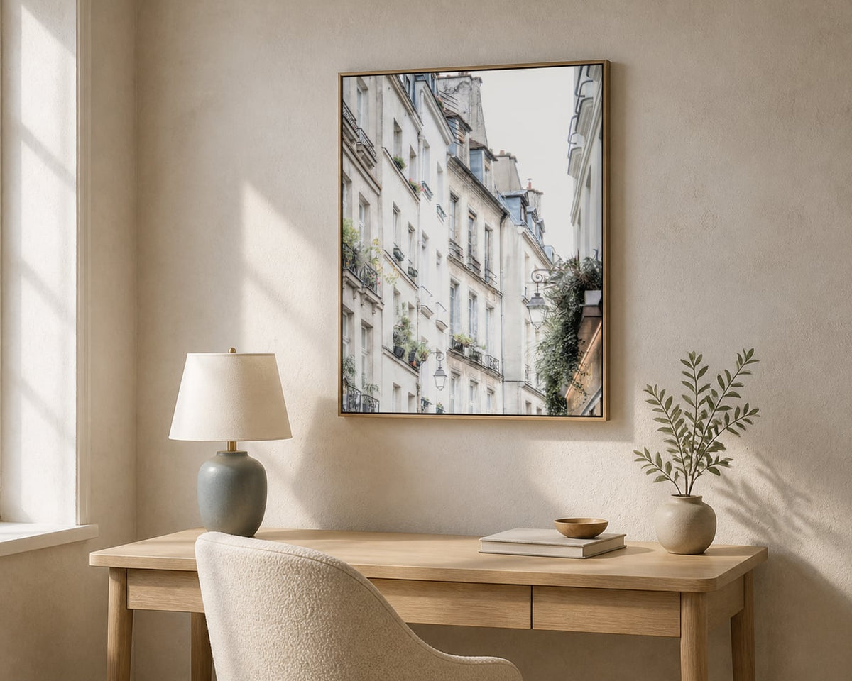 Parisian Facade Print above a light oak desk in a pale limestone home office