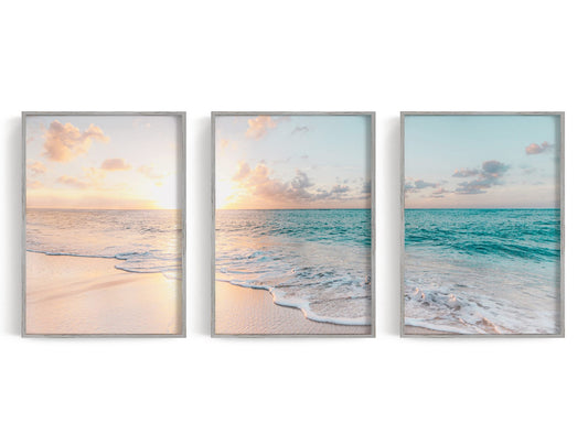 Three pastel shoreline prints in peach, turquoise, and blue displayed together