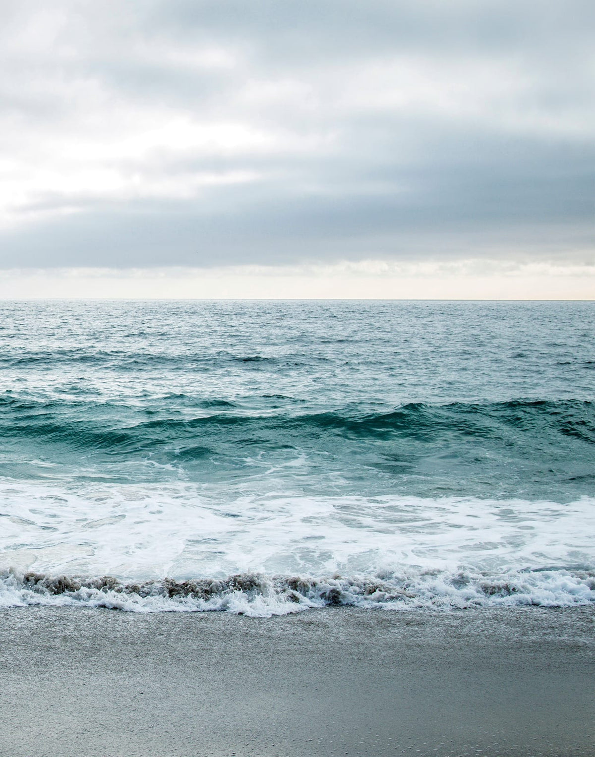 Two blue-gray shoreline prints with pale surf and a quiet coastal horizon, panel 2 of 2