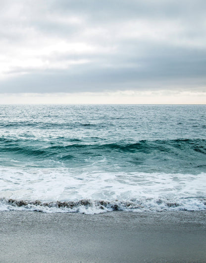Two blue-gray shoreline prints with pale surf and a quiet coastal horizon, panel 2 of 2