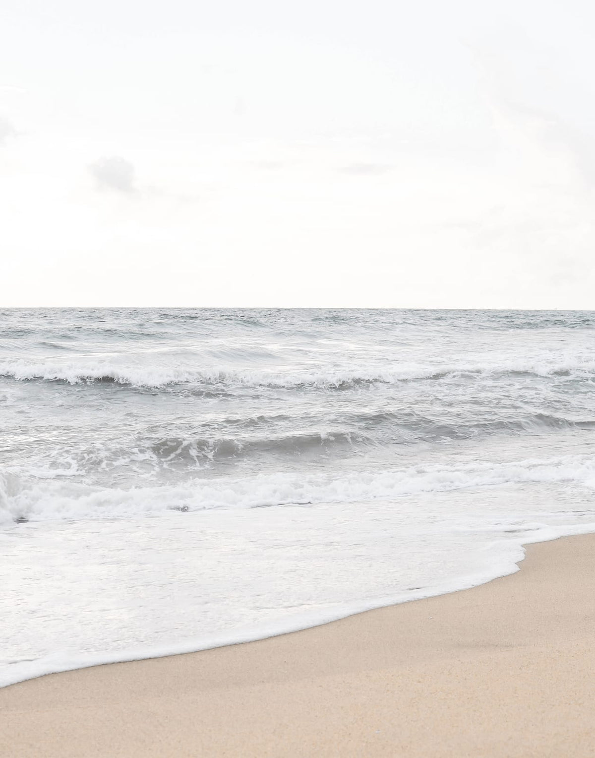 Coastal print with open water and a pale sandy shoreline