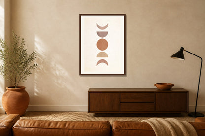 Stacked Moon Phases Print print displayed in a living room matched to its terracotta, sand, black palette