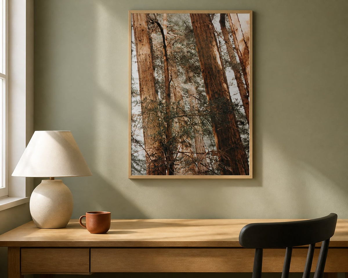 Sunlit Redwoods Print above a natural oak desk in a pale sage home office