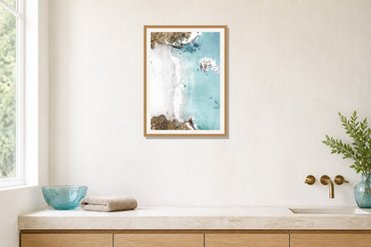 Turquoise Beach Aerial Print print displayed in a bathroom matched to its turquoise, aqua, white palette