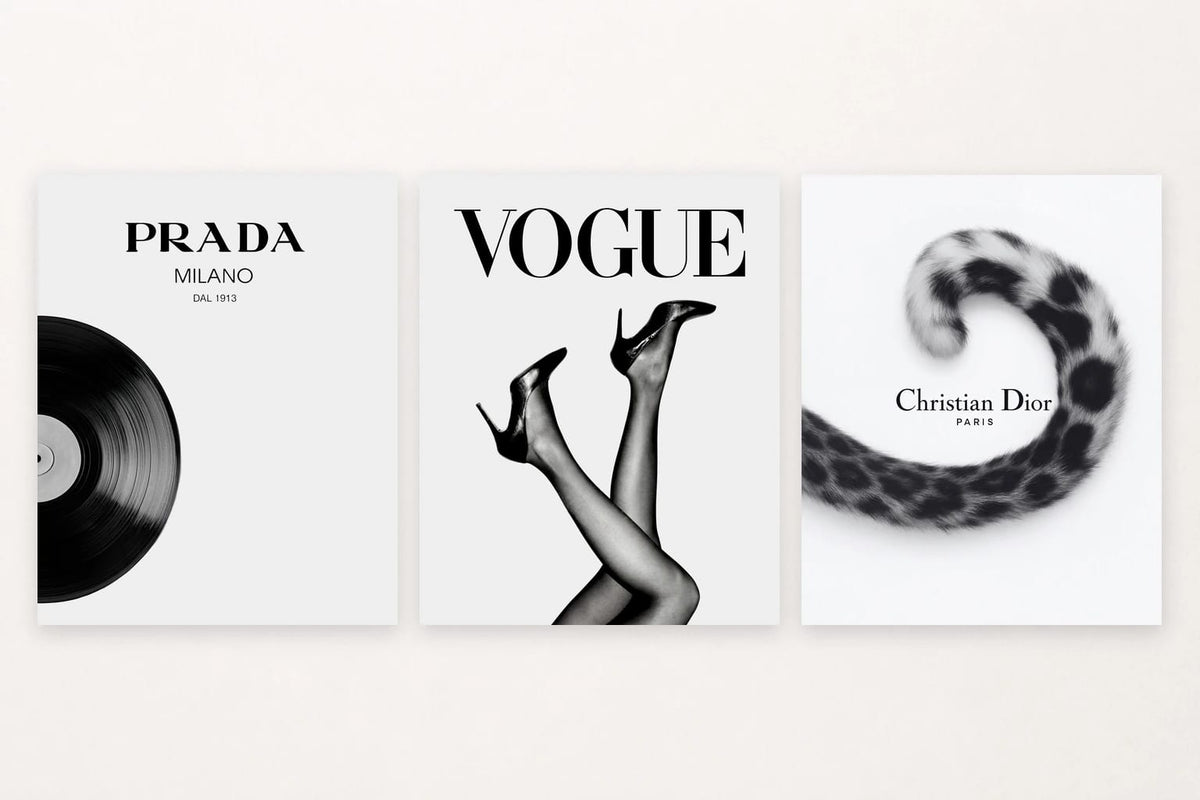 Three black-and-white prints show a vinyl record, shoes, and a spotted tail with large lettering.