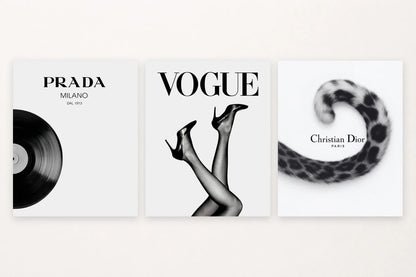 Three black-and-white prints show a vinyl record, shoes, and a spotted tail with large lettering.