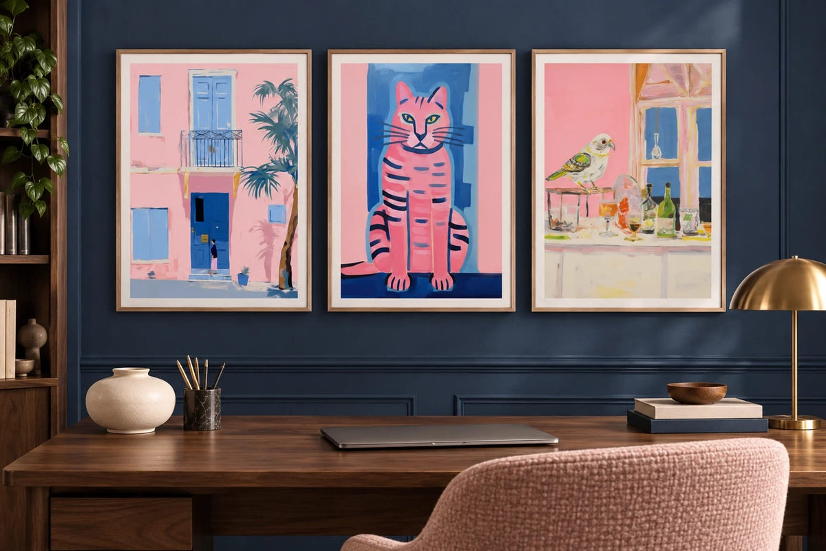 Pink facade, striped cat, and bird prints appear in a blue office with a wooden desk.