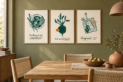 Three food prints hang on an olive wall above a dining table.