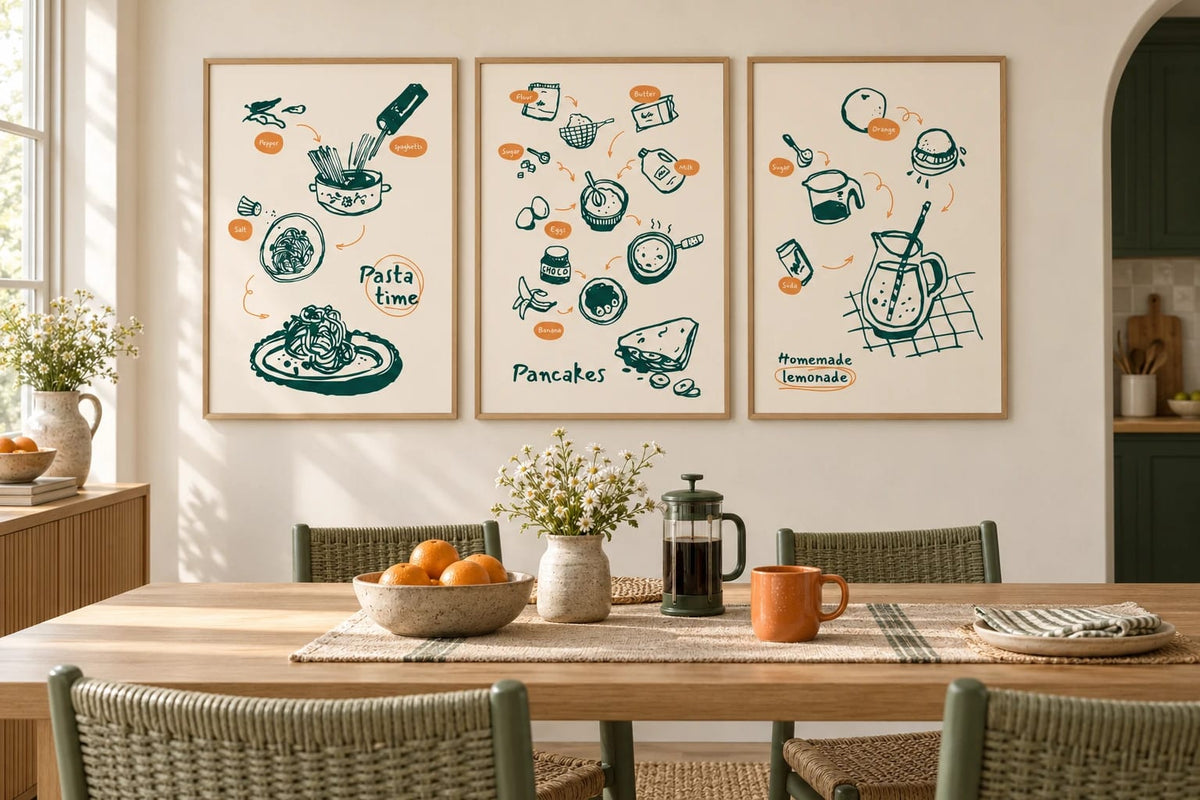 Pasta, pancake, and lemonade prints appear in a light dining room with a wooden table.
