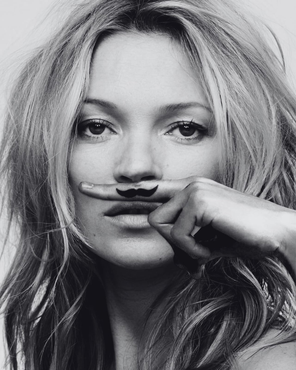 A portrait with a drawn mustache.