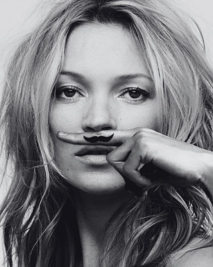 A portrait with a drawn mustache.