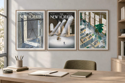 Three architectural prints hang above a desk in a gray home office.